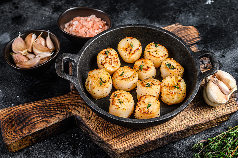 seared scallops in cast iron pan